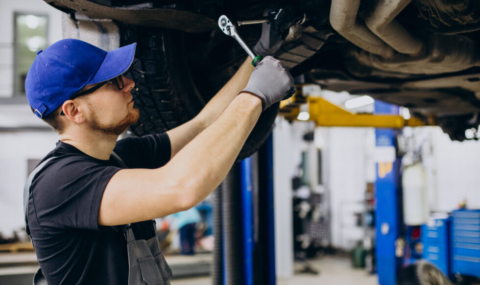 Car mechanist making car service